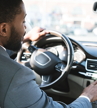 Man Driving a New Car